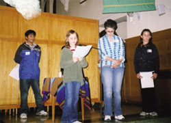... as others sing songs and offer prayers for peace.