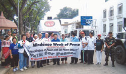 Sr. Mary Gauthier (centre) and members of the interfaith group lead the Walk for Peace at the Mindanao Week of Peace celebration 2007. Philippines.