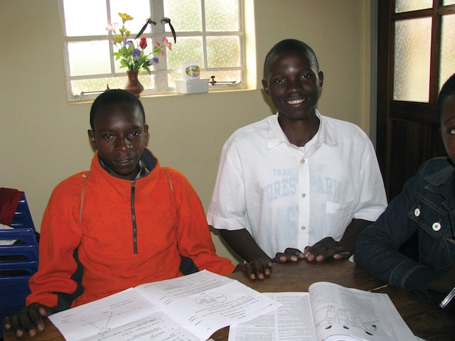 Benjamin (Form 2) with his tutor Isaiah.